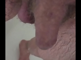 Pulling back my huge soft cock's foreskin in the shower